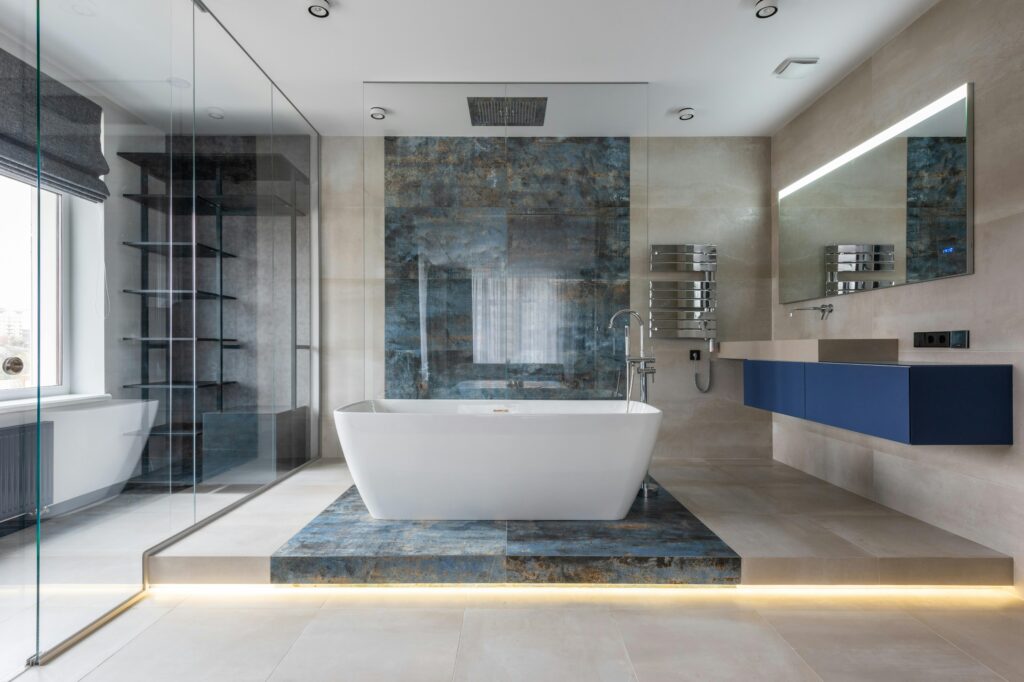 Bathroom with a bathtub on top of an accent wall made from blue and black stone. The best deep cleaning in Wheat Ridge