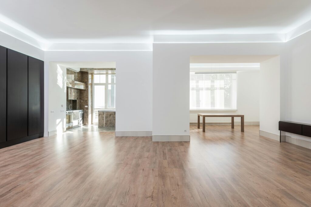 Empty room with hardwood floors and white walls. the best move-out cleaning services in Fort Logan