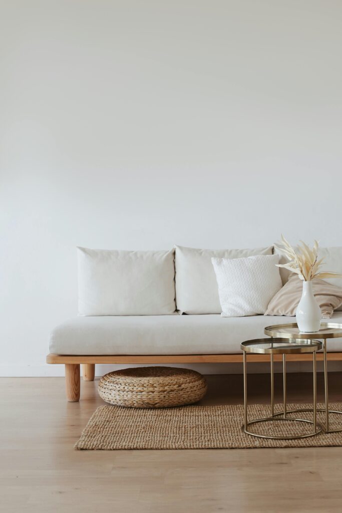 Cream colored couch with a small coffee table in front of it. The best home cleaning services in Lakewood, CO. The best home cleaning services in Fort Logan